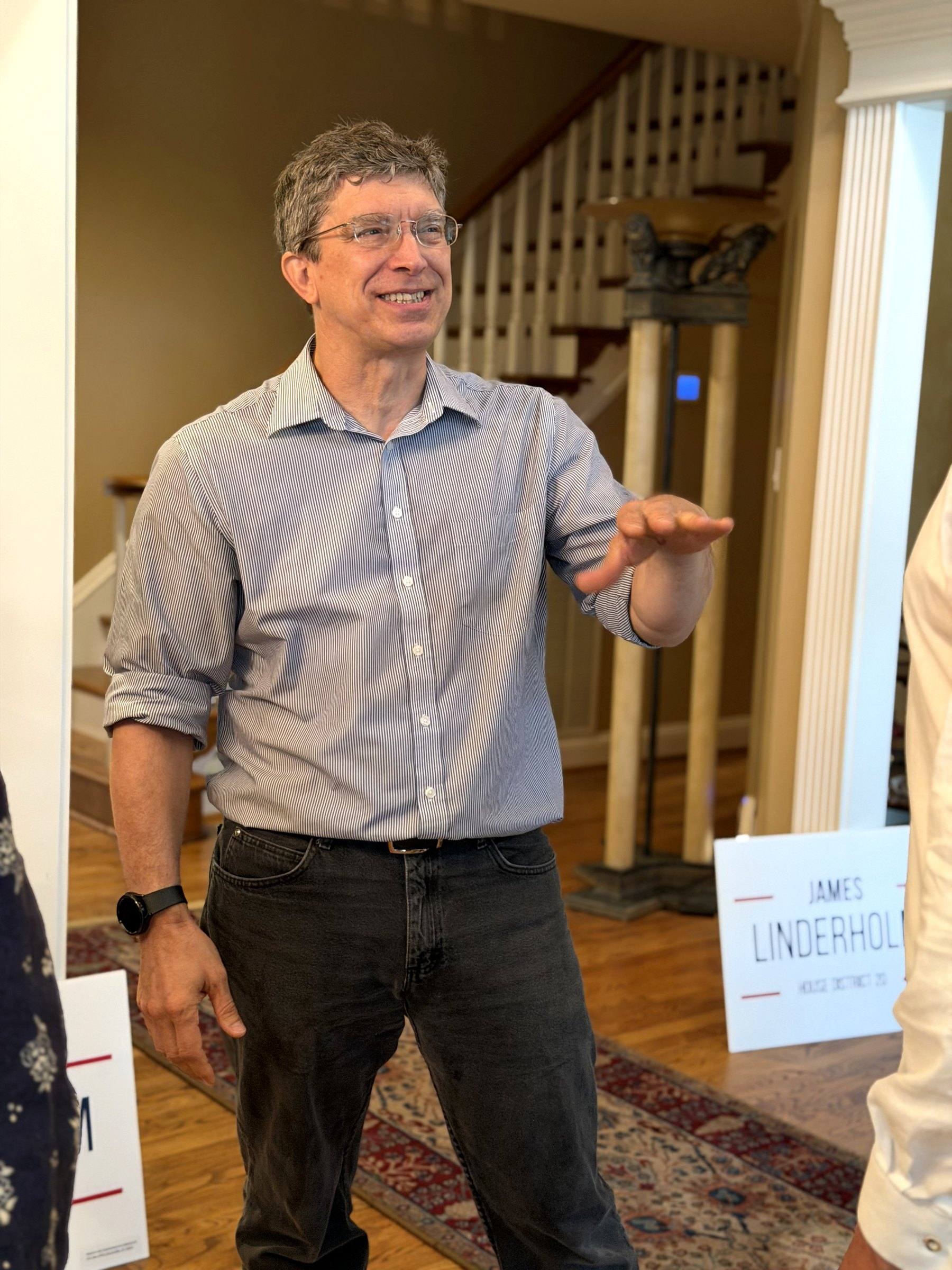 James Linderholm talking with neighbors at a house meeting in Huntsville